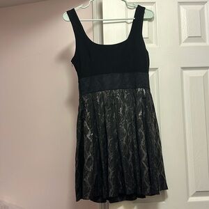Black pleated dress with fancy skirt and back